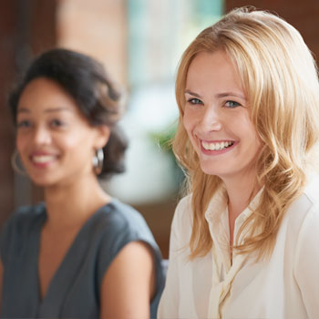 Two business women laughing